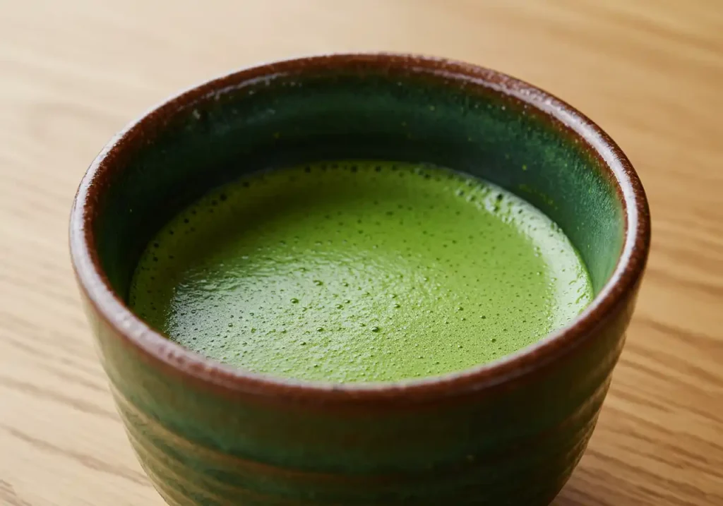 Close-up surface of Japanese Mounjaro Recipe detox drink with smooth matcha layer