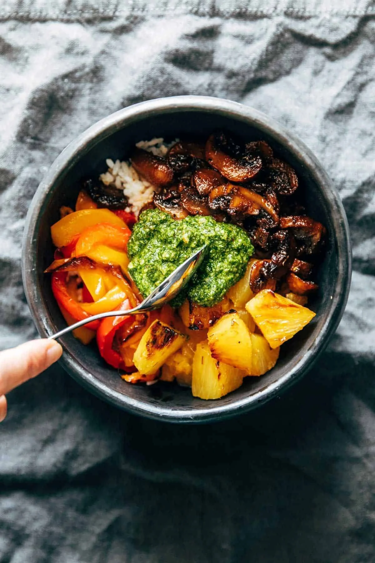 Delicious mushroom bowls topped with vibrant kale pesto served in a stylish dish