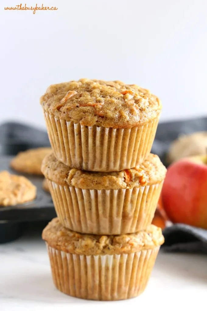 Freshly baked apple carrot ginger muffins on a cooling rack