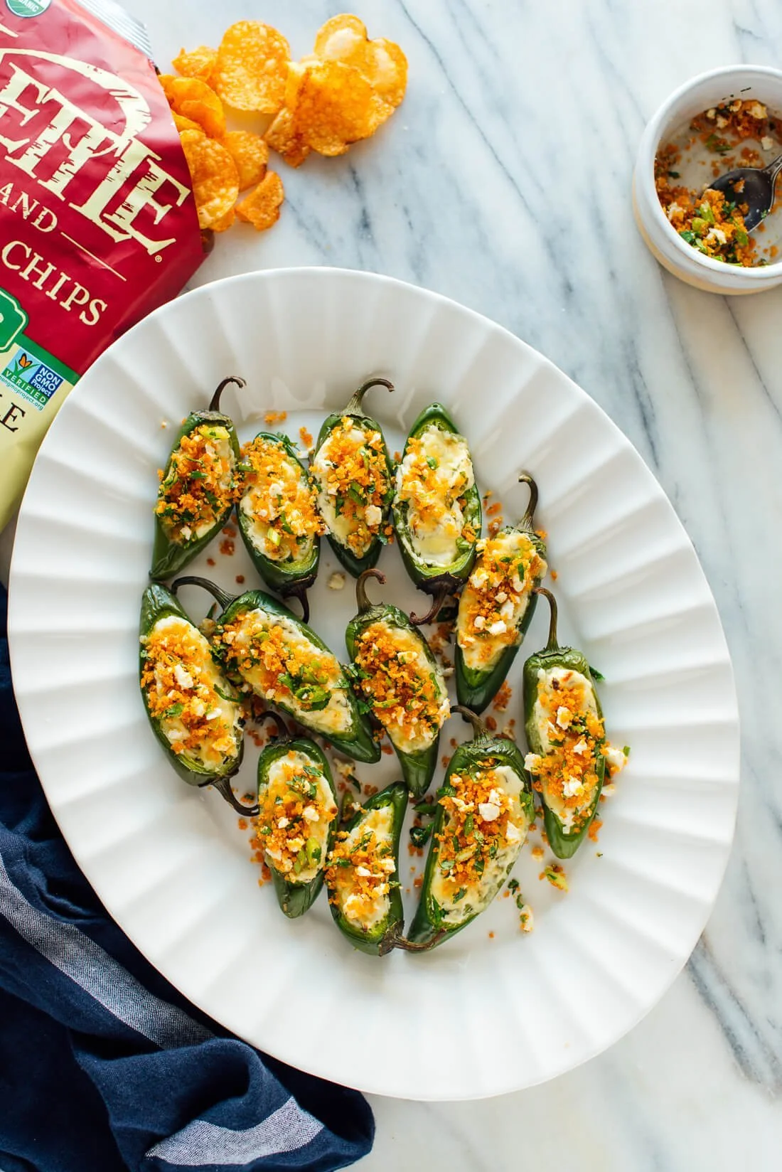 Baked jalapeño poppers with cheese and spices on a plate