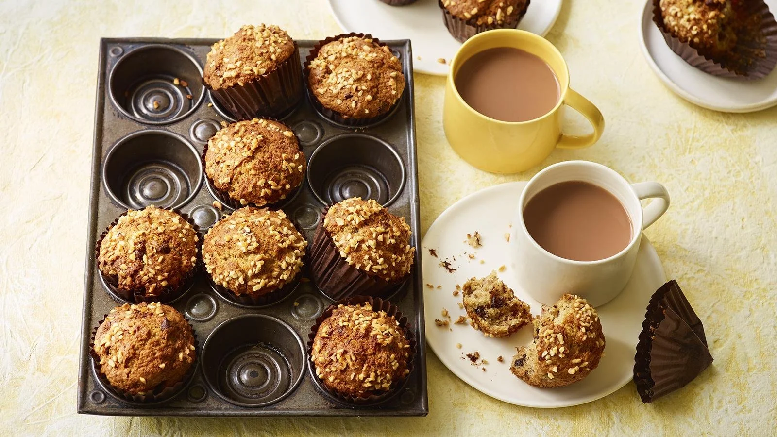 Freshly baked banana chocolate muffins on a cooling rack