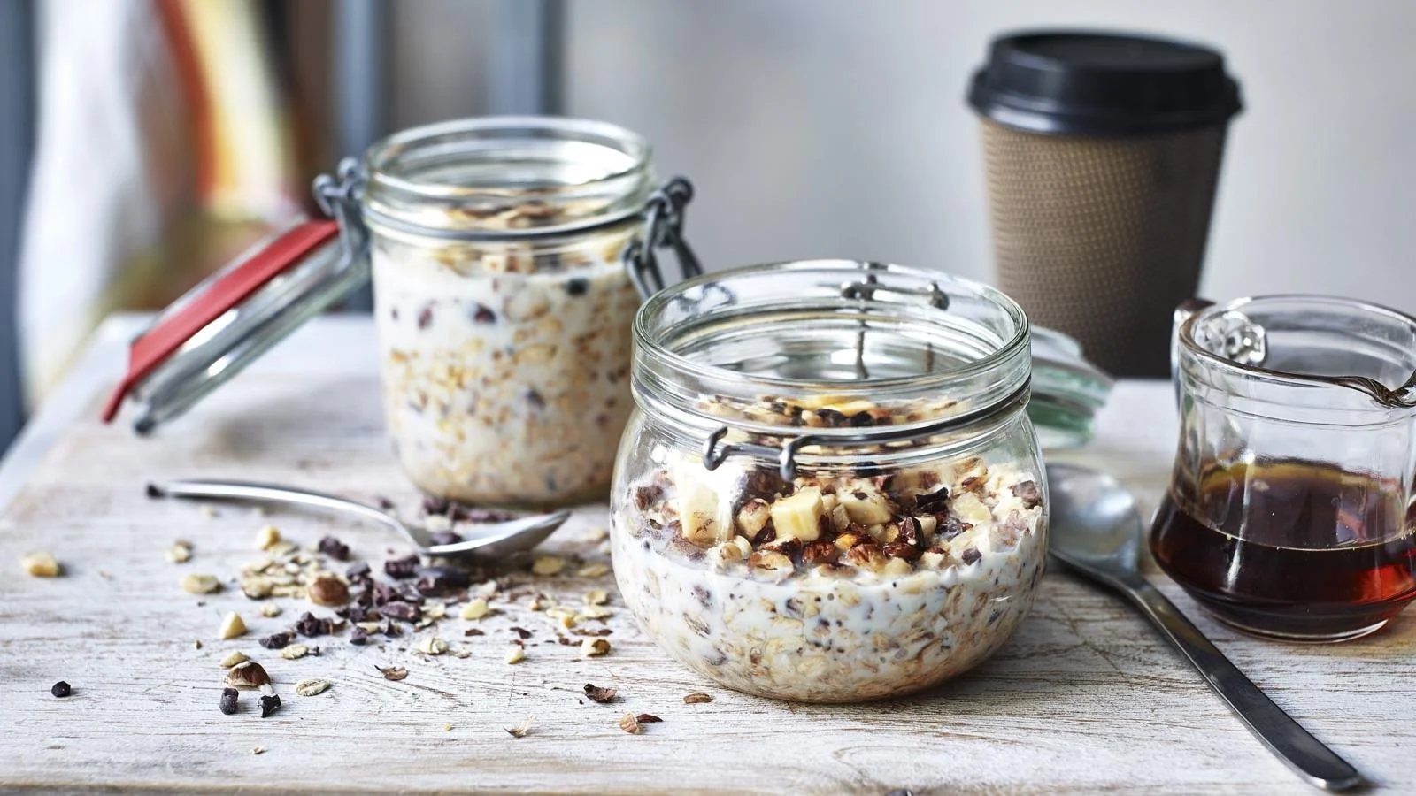 Bowl of Banana Cocoa Crunch Overnight Oats topped with fresh bananas and cocoa nibs.