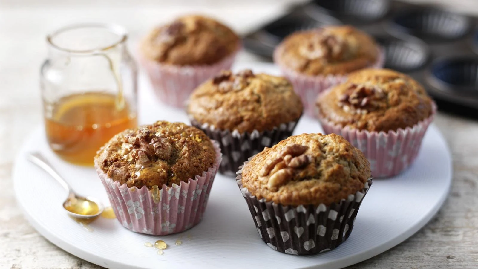 Delicious homemade banana muffins on a wooden table, perfect for breakfast