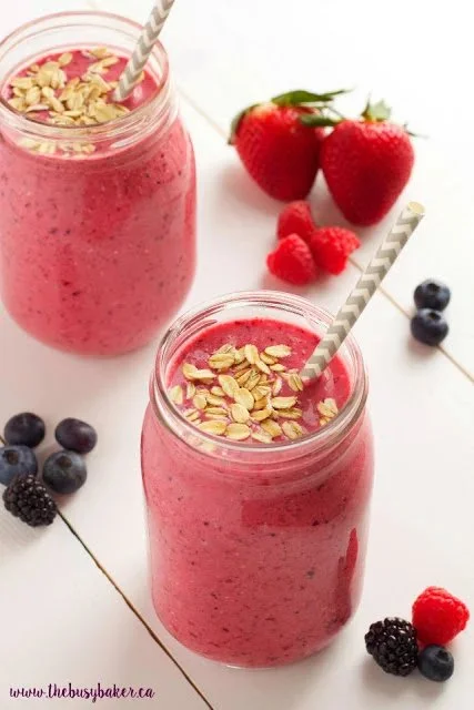 Berry Banana Oat Smoothie with fresh berries and oats in a glass