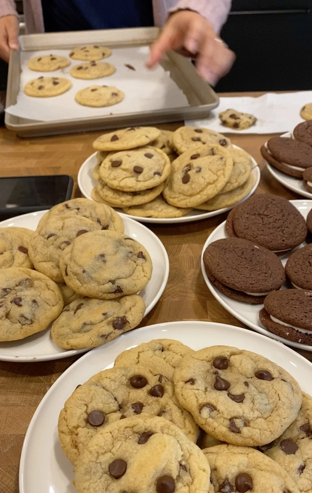 Baked browned butter chocolate chip cookies on a cooling rack.