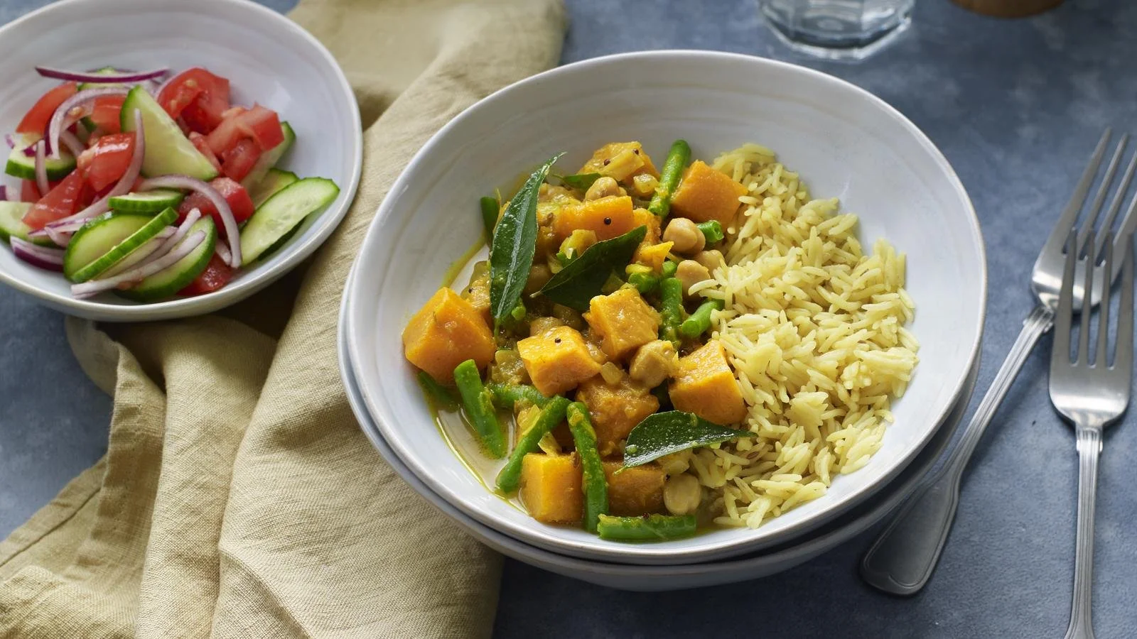 Bowl of Butternut Squash Curry with Chickpeas garnished with cilantro