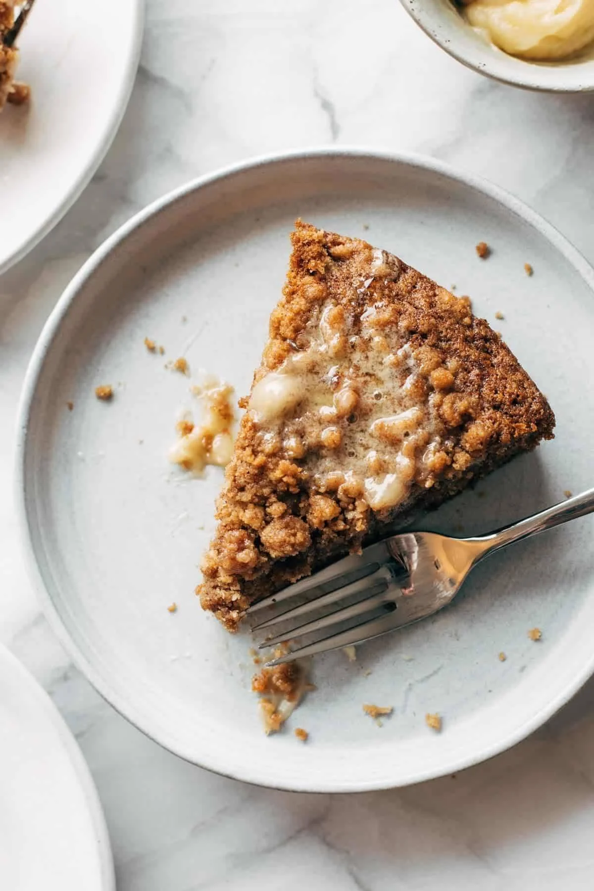 Delicious carrot cake coffee cake topped with cream cheese icing.