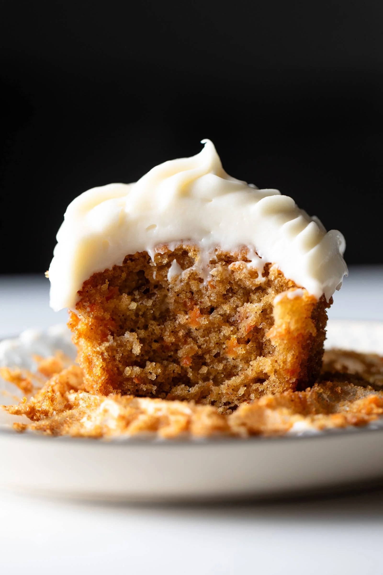 Delicious carrot cake cupcakes topped with cream cheese frosting