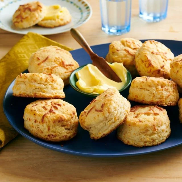 Homemade cheddar biscuits fresh out of the oven, golden and cheesy