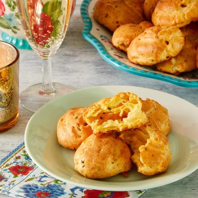 Delicious homemade cheese puffs served on a wooden platter