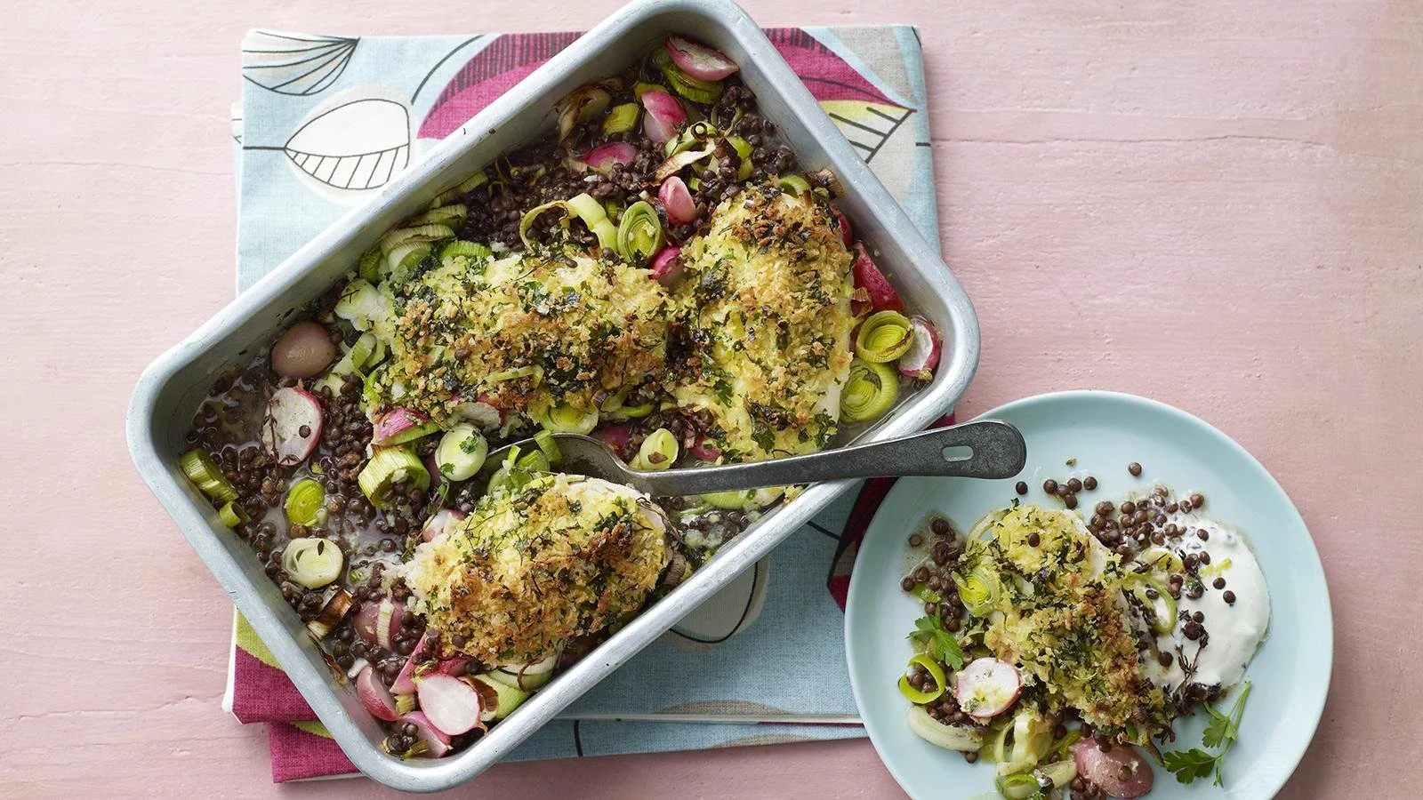 Delicious chicken and leek traybake served hot in a baking dish.