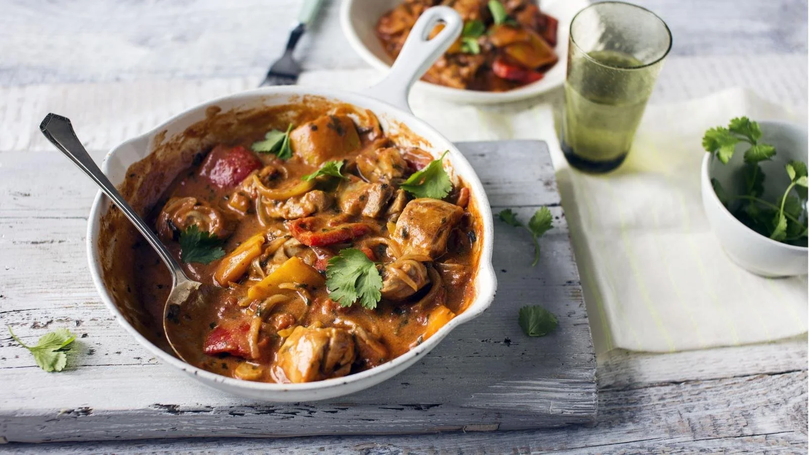 Delicious chicken curry with colorful peppers ready to serve.
