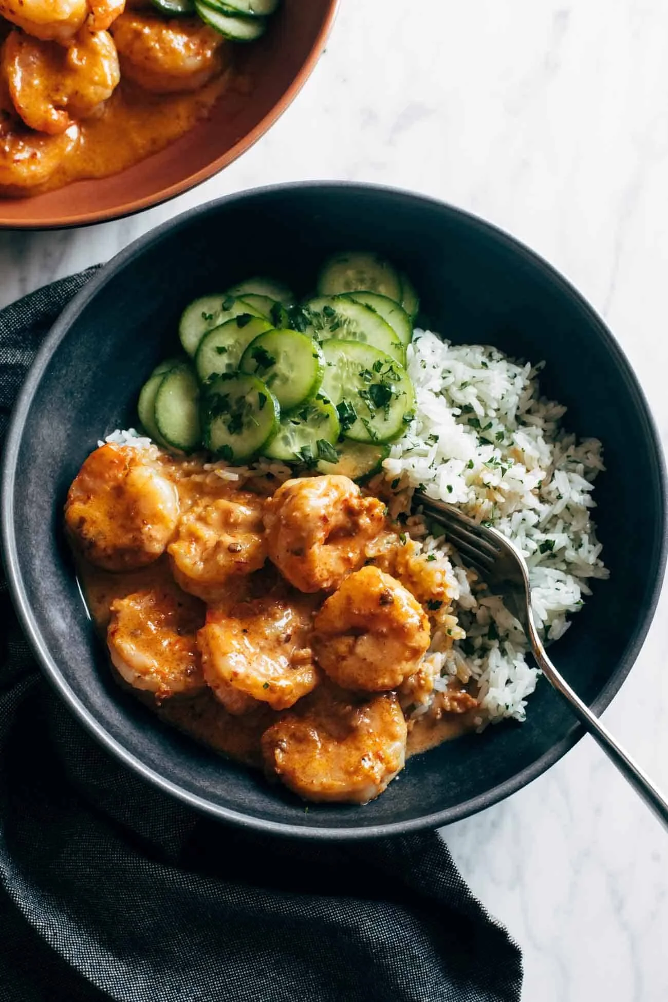 Chipotle Orange Shrimp served with cilantro rice in a white bowl