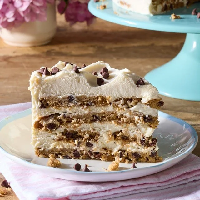 Chocolate Chip Cookie Icebox Cake topped with whipped cream and chocolate chips.