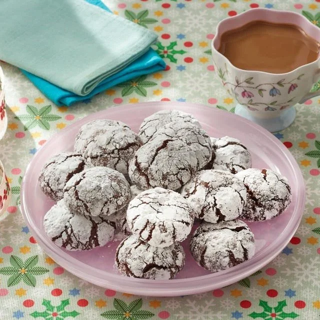 Baking Chocolate Crinkle Cookies with powdered sugar on top