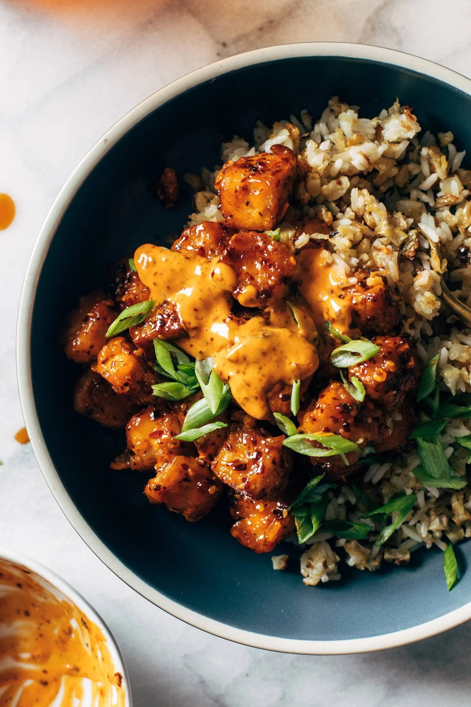 Deliciously crispy Chili Crunch Tofu served with vibrant toppings