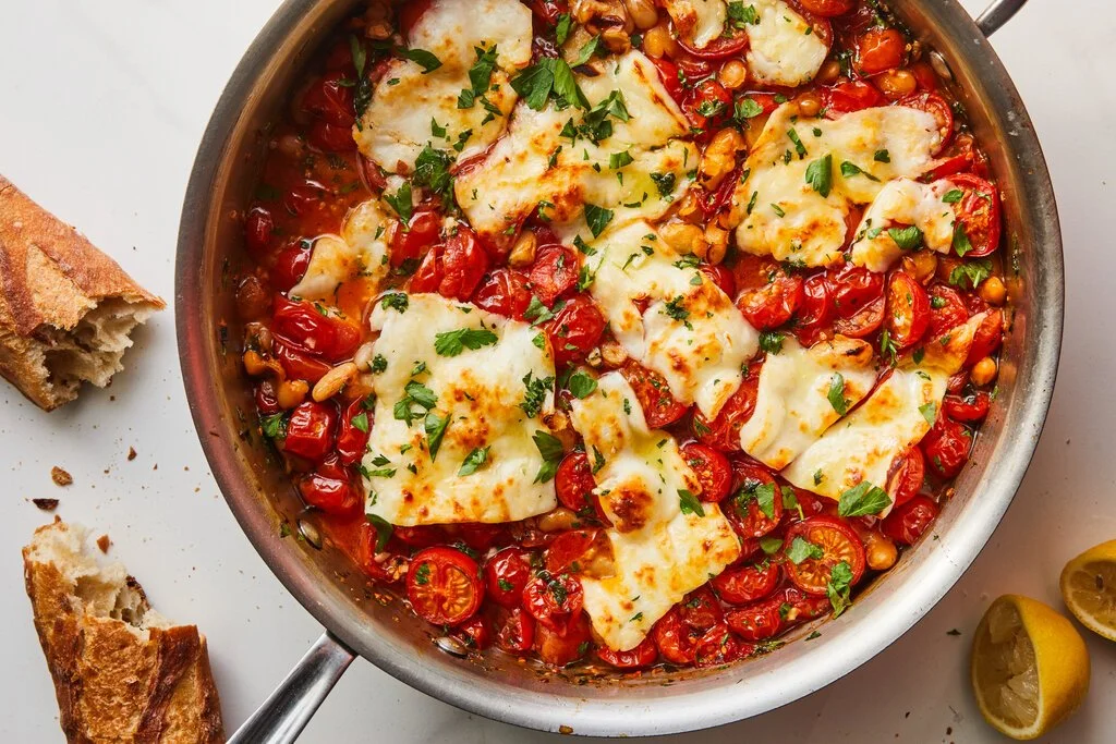 Crispy halloumi served with fresh tomatoes and beans in a vibrant dish