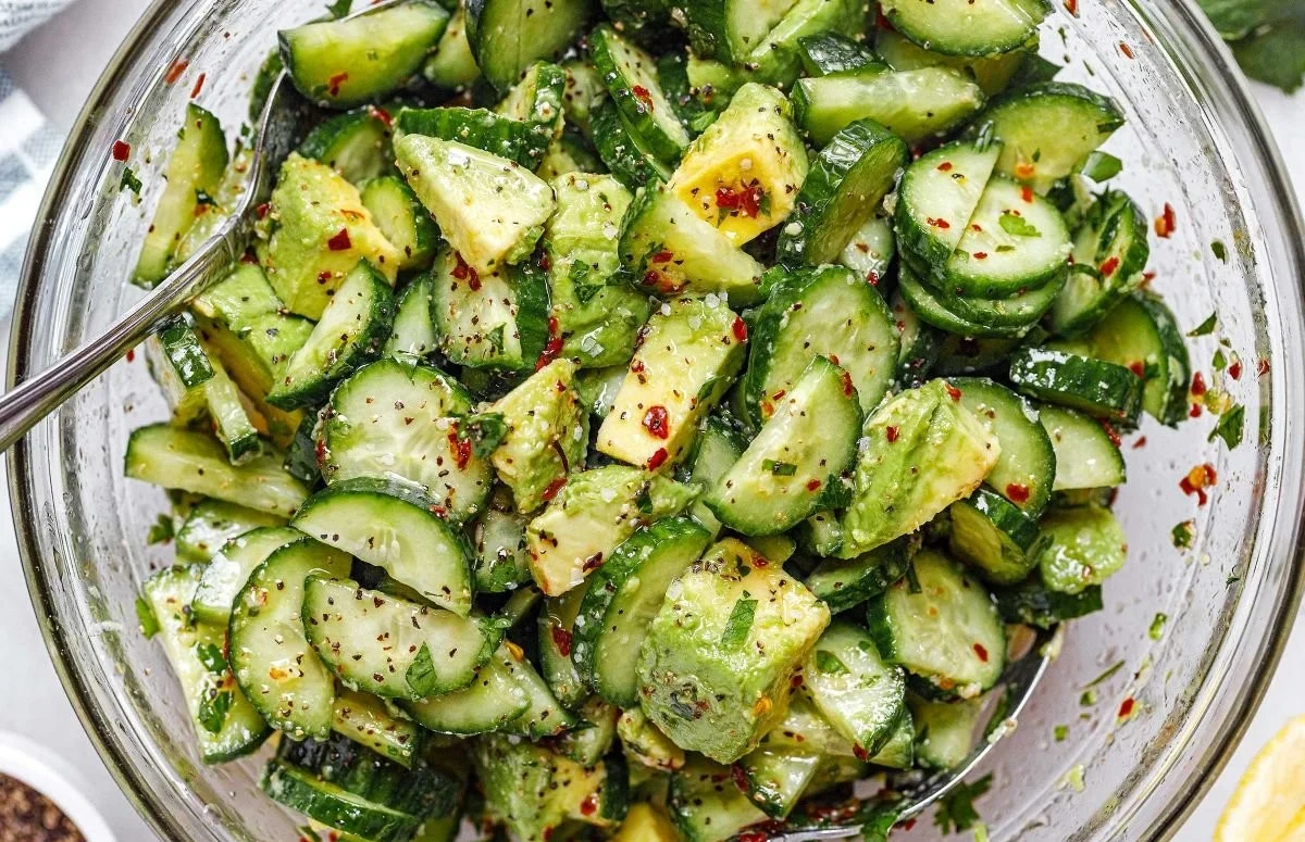 A refreshing Cucumber Avocado Salad with vibrant ingredients in a bowl.