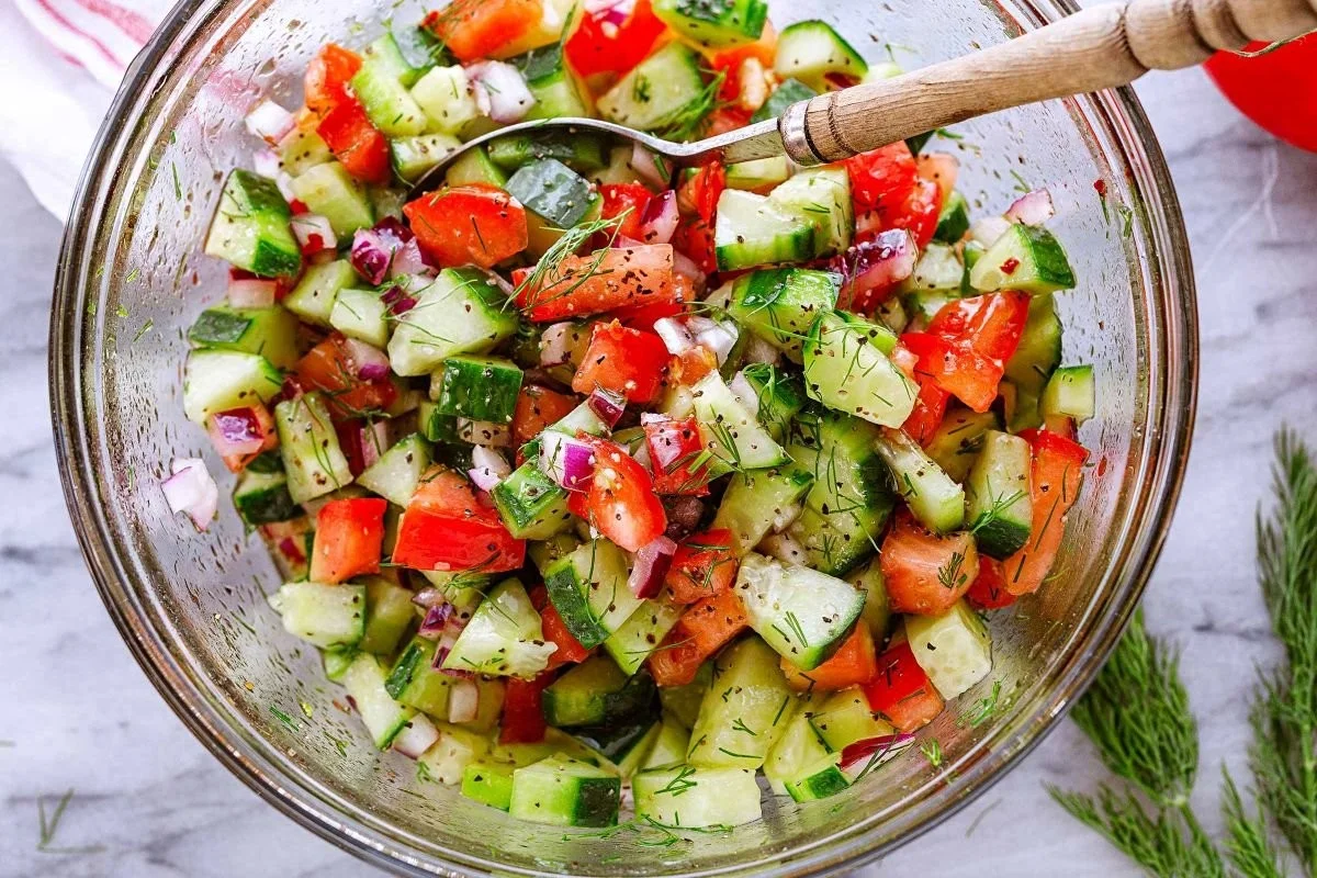 A colorful Dill Tomato Salad with fresh tomatoes and dill leaves.