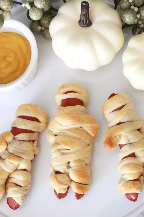 Easy mummy hot dogs wrapped in dough for Halloween fun