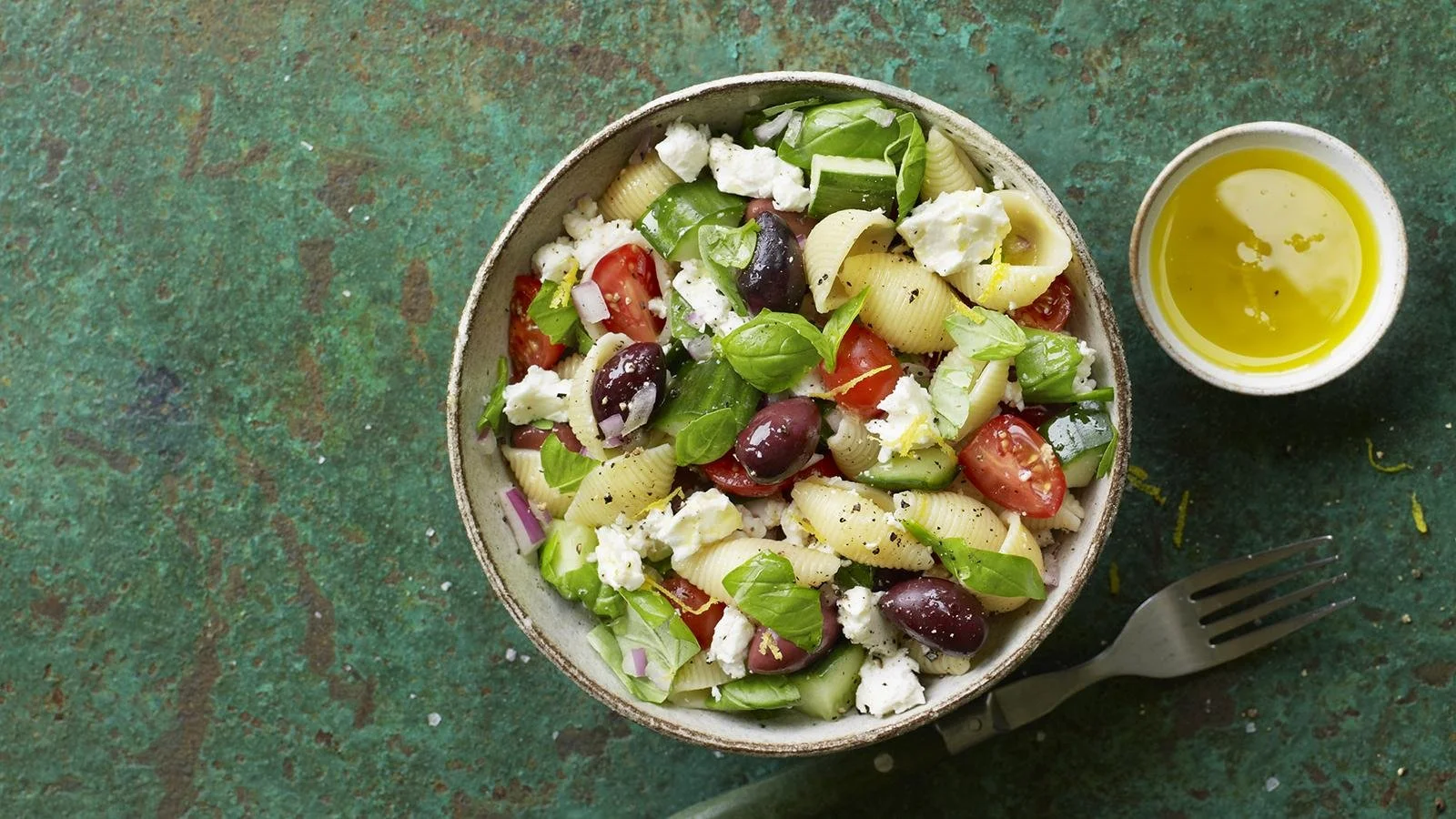 Bowl of easy pasta salad with colorful vegetables and dressing