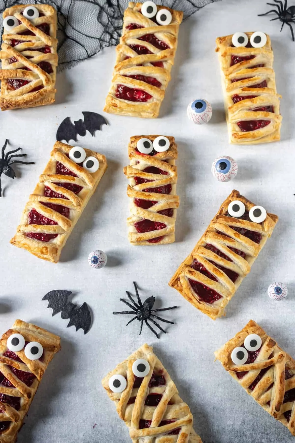 Easy Raspberry Mummy Pies decorated for Halloween