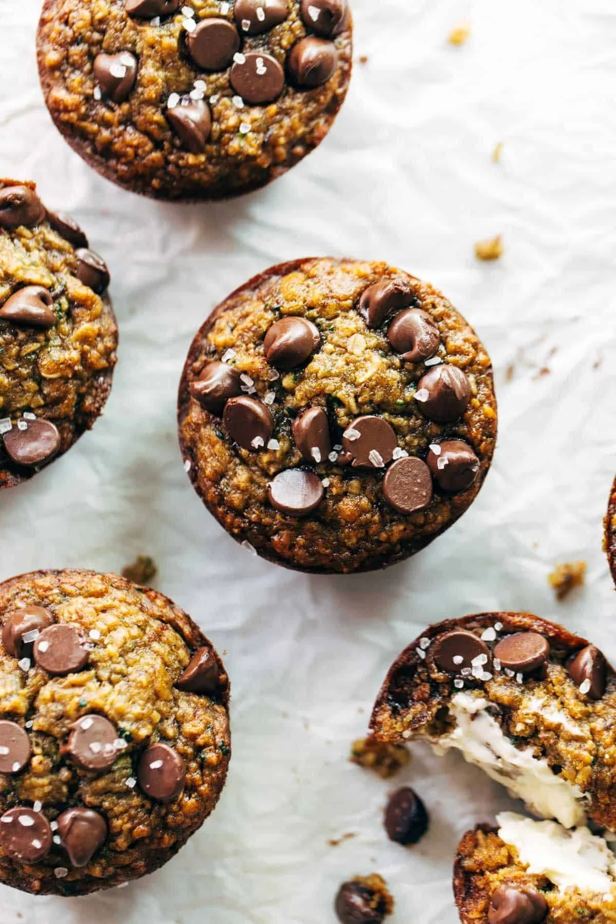 Freshly baked zucchini muffins on a rustic wooden table