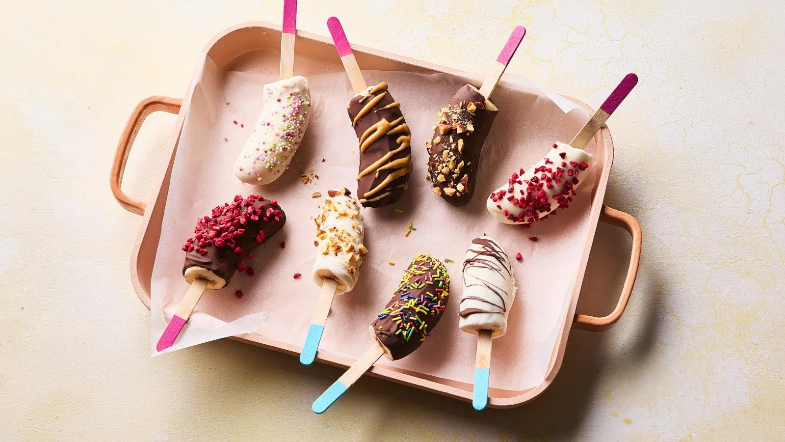 Frozen banana lollies on a stick, a healthy and refreshing treat.
