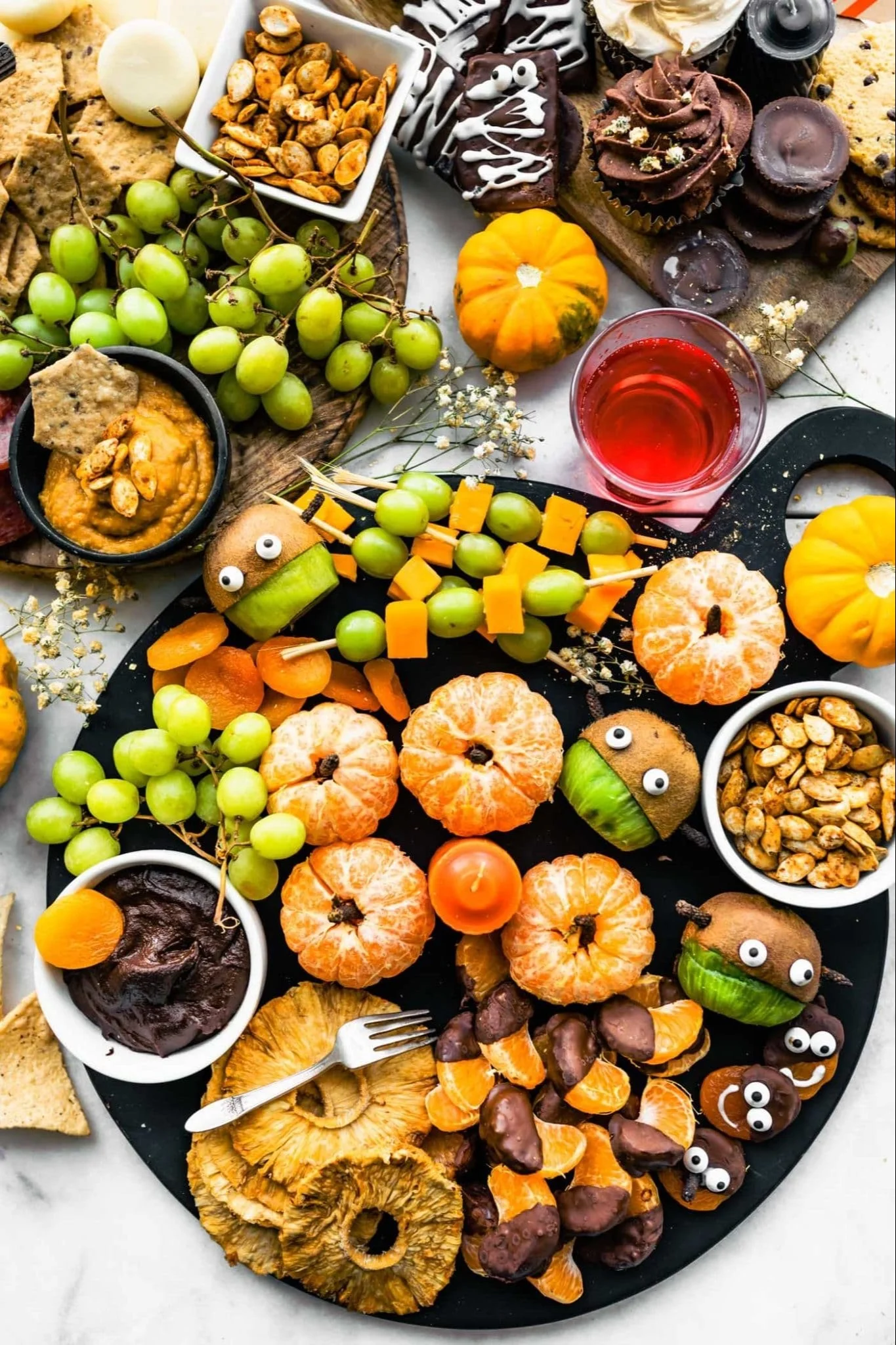 Gluten-free Halloween charcuterie board with spooky-themed snacks