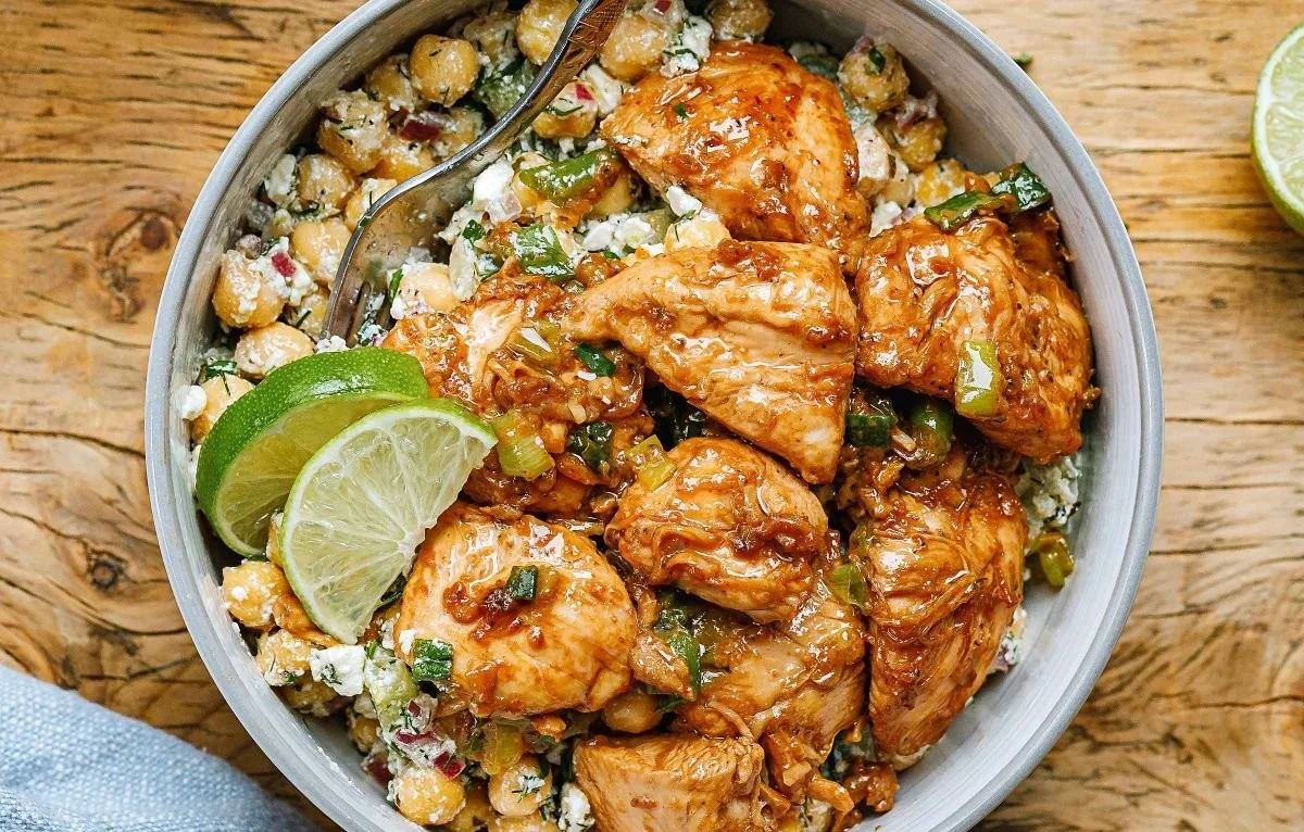 Delicious Greek Chickpea Chicken Bowl garnished with fresh vegetables and herbs