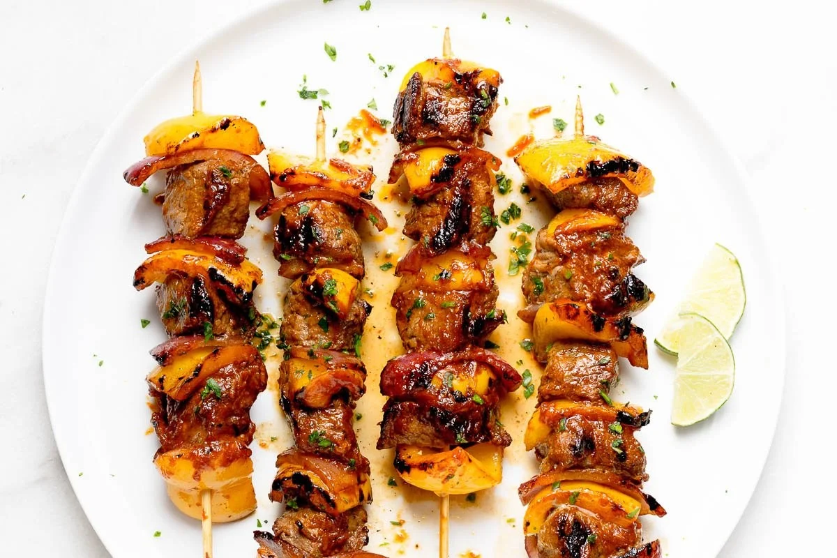 Grilled steak kabobs with colorful vegetables on skewers