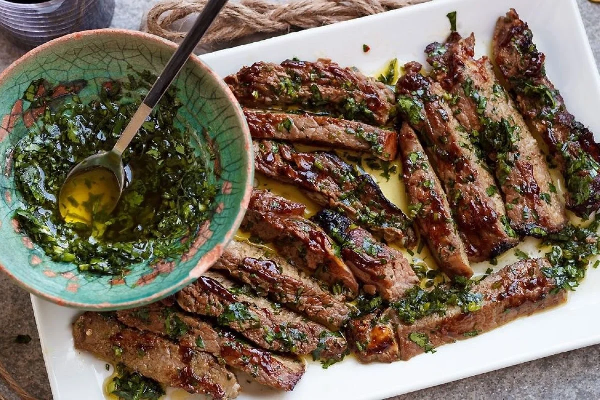 Delicious grilled steak served with vibrant parsley sauce