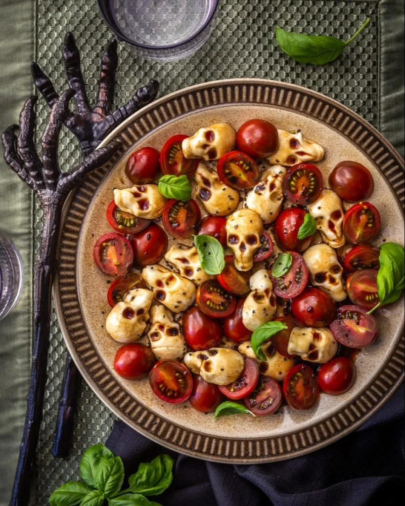 Halloween Caprese Salad with spooky ingredients and colors for festive gatherings