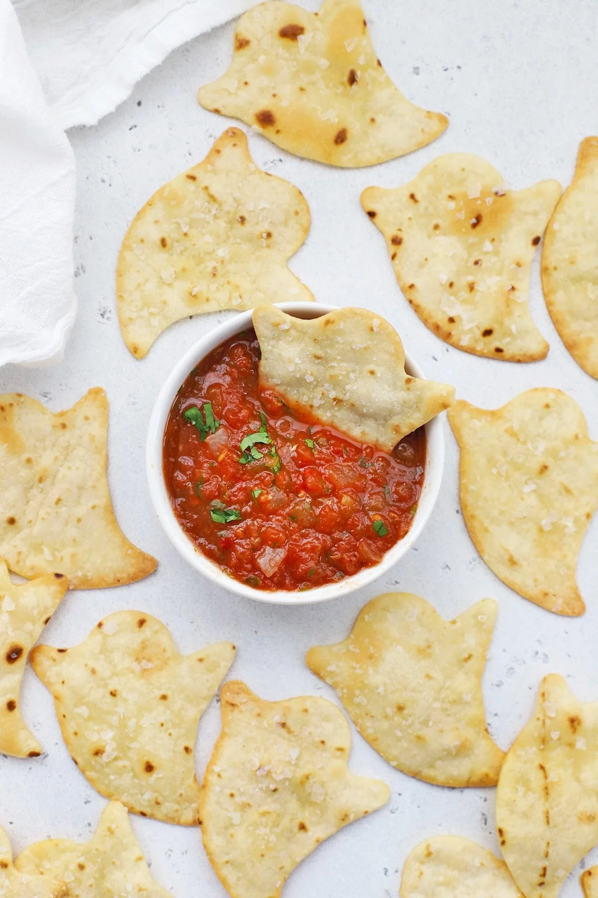 Crunchy ghost-shaped baked chips for Halloween snacks