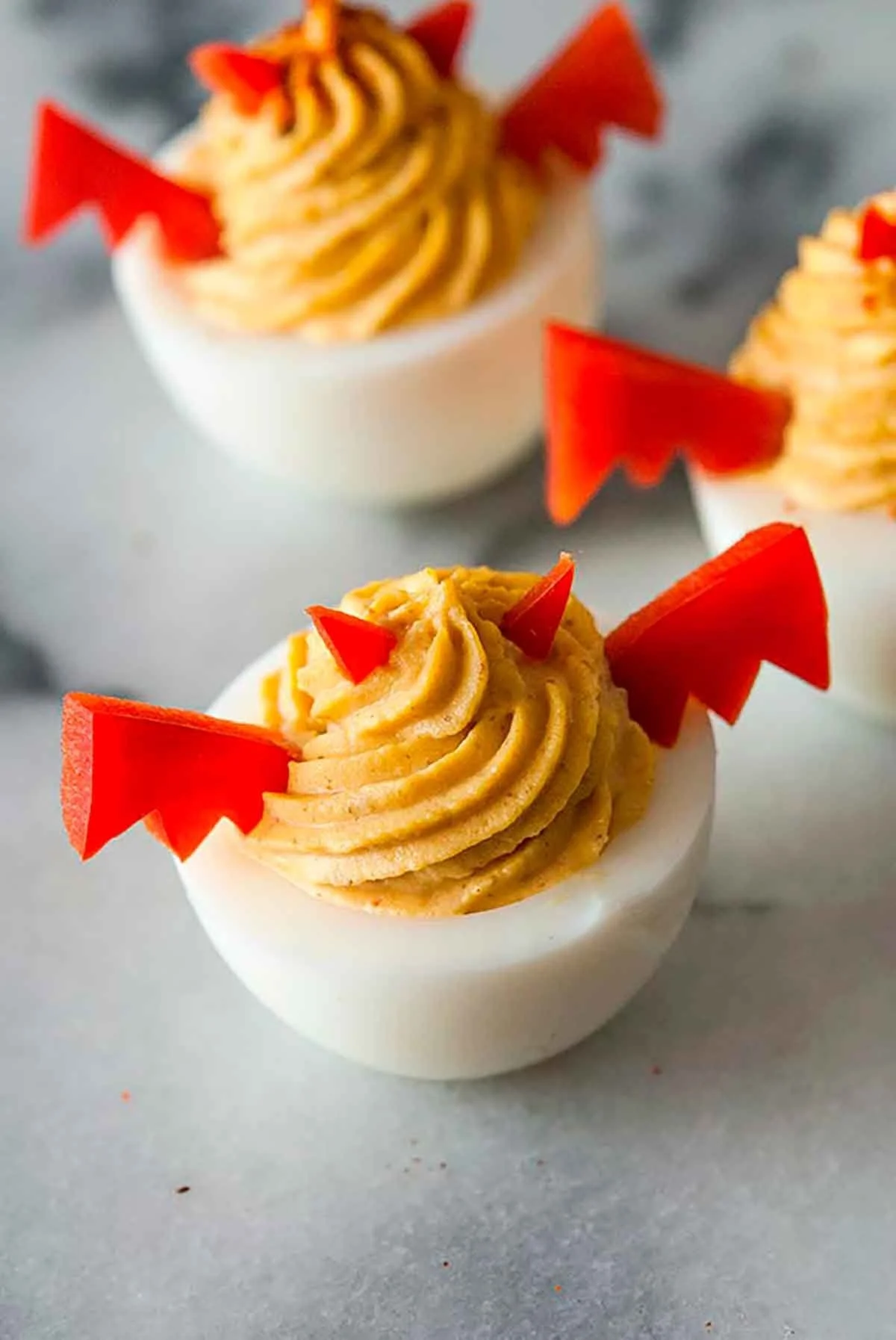 Halloween spooky deviled eggs decorated to look creepy and festive