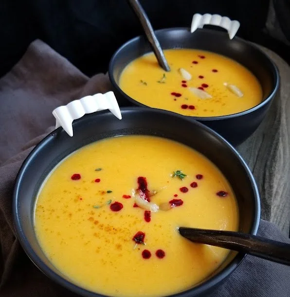 A bowl of Halloween Vampire Slayer Soup with spooky garnishes.