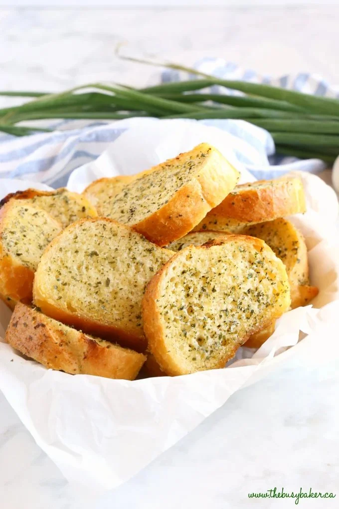 Loaf of homemade garlic bread sliced and ready to serve