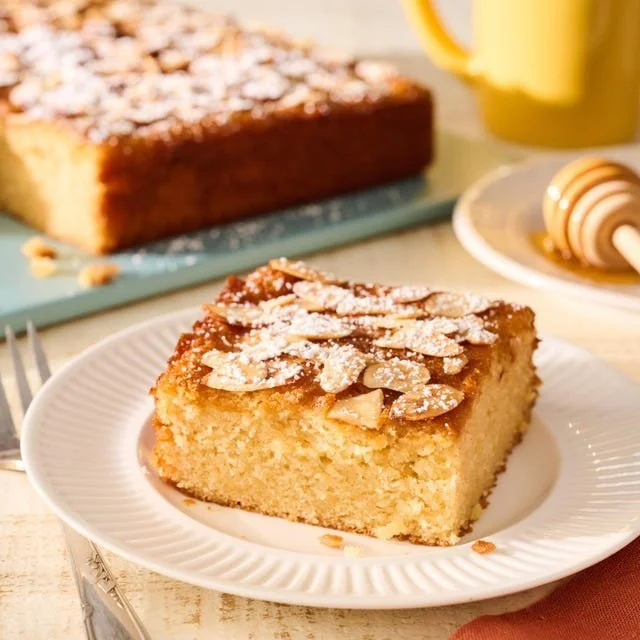 Delicious homemade honey cake topped with a drizzle of honey
