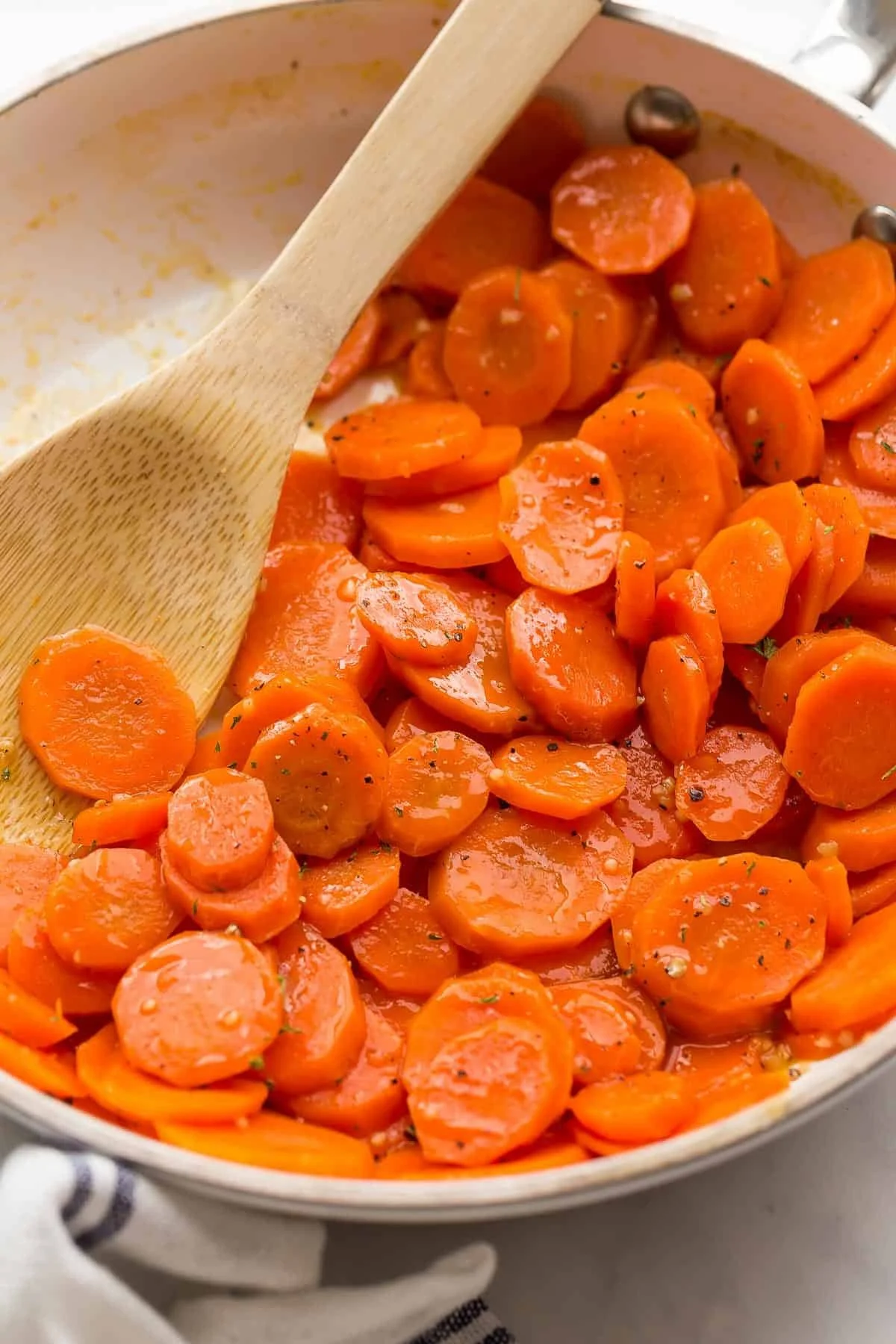 Delicious honey glazed carrots garnished with fresh herbs