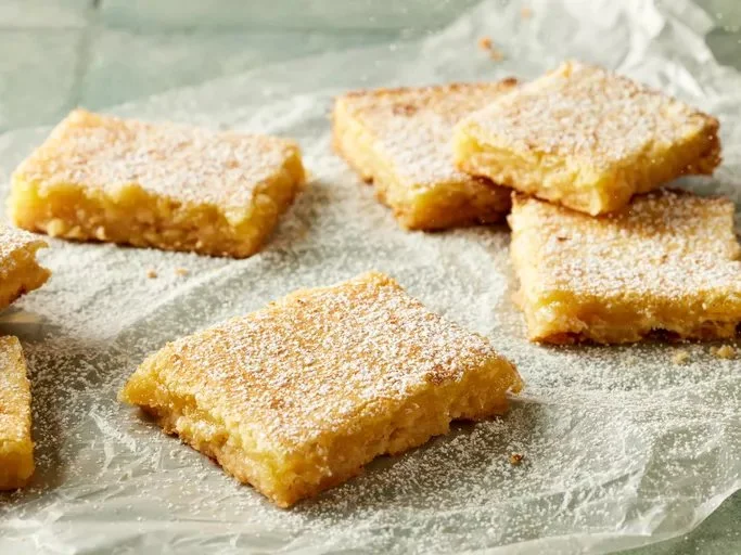 Freshly baked lemon bars with a powdered sugar topping