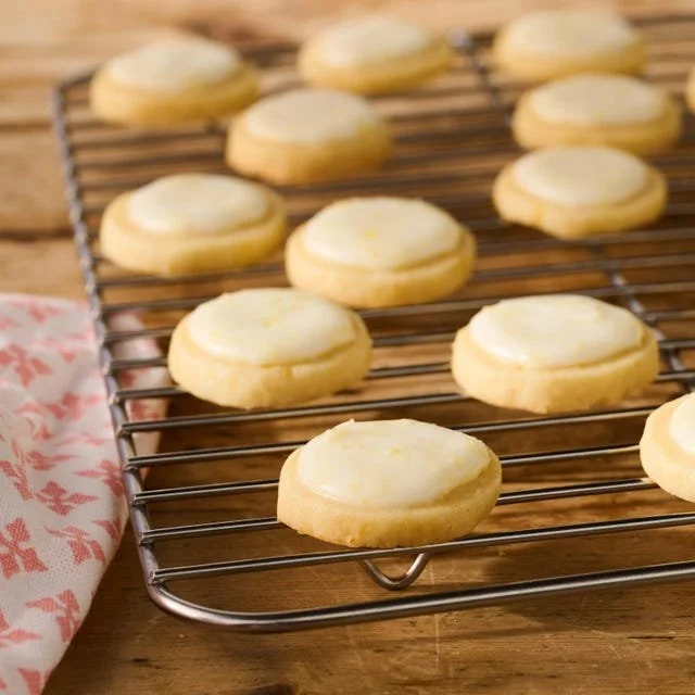 Soft and zesty lemon meltaways on a decorative plate