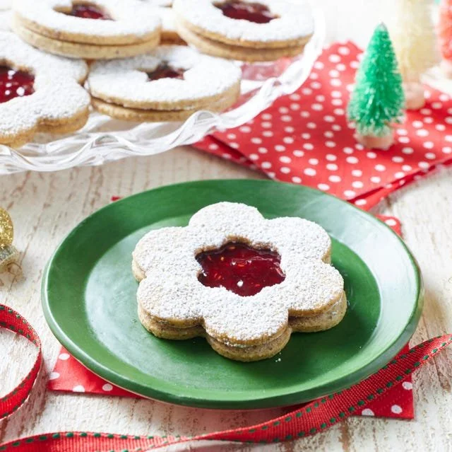 Delicious homemade Linzer Cookies filled with raspberry jam and dusted with powdered sugar.