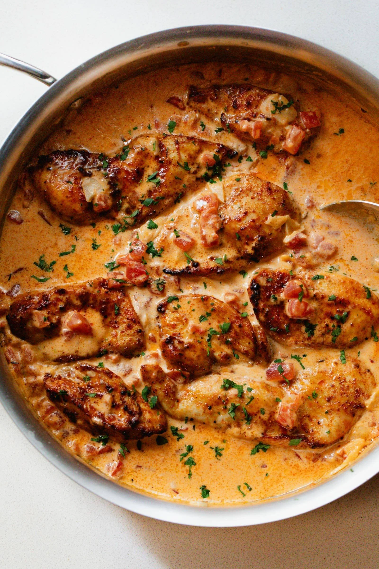 Delicious Marry Me Chicken served with creamy sauce and fresh herbs