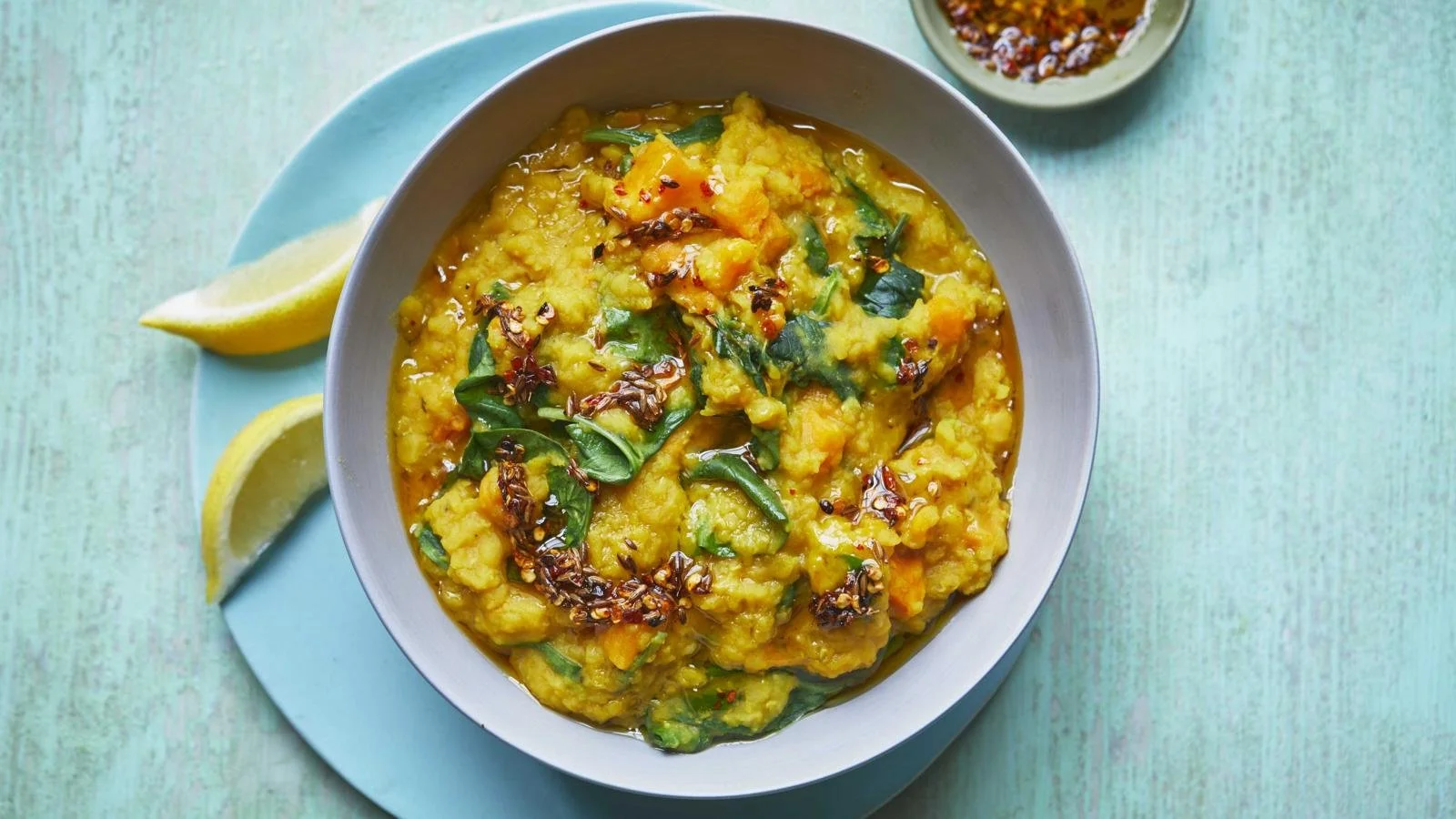 Microwave spinach and sweet potato dal served in a bowl with herbs