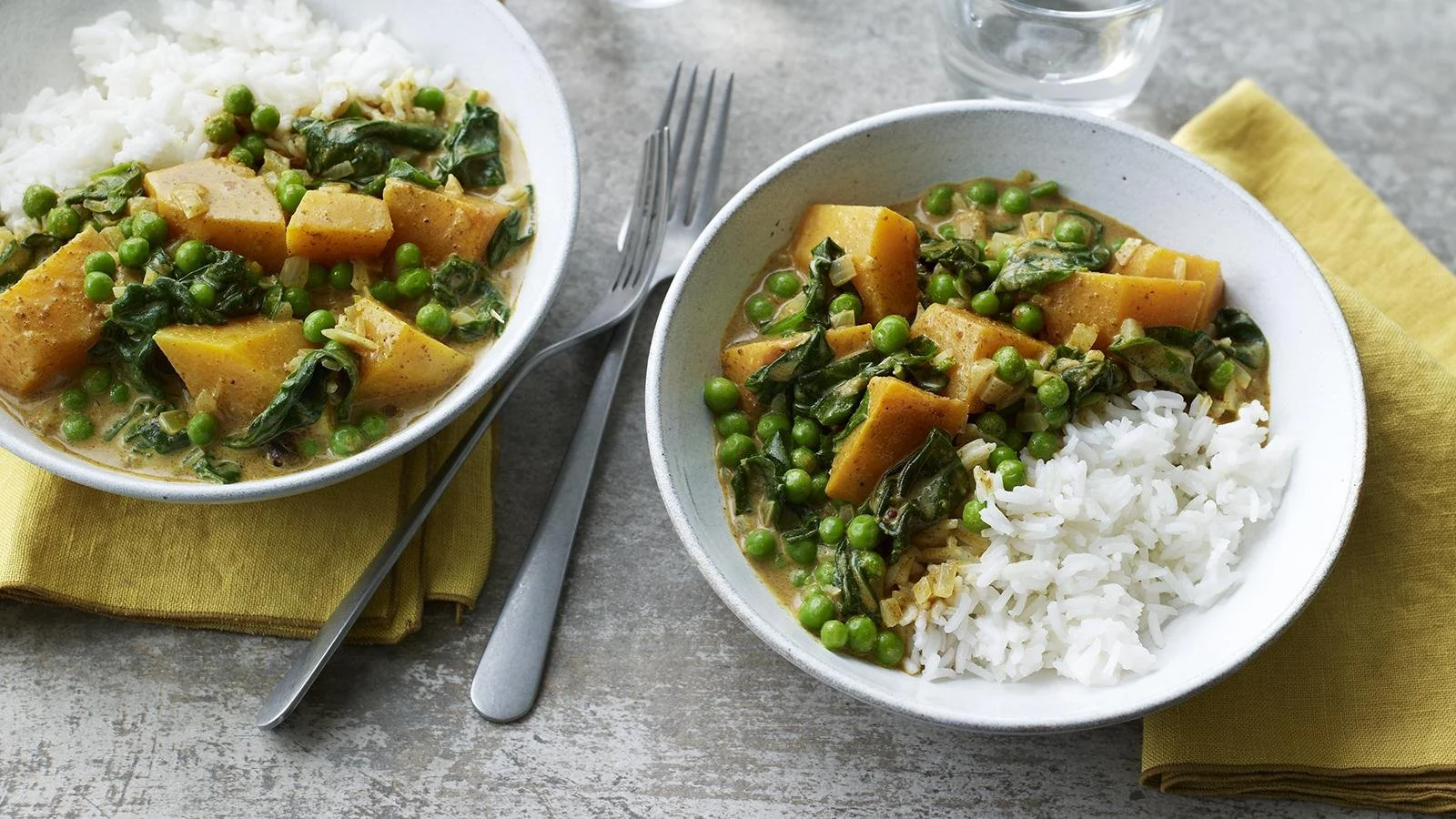 Bowl of microwave vegetable curry with colorful fresh vegetables