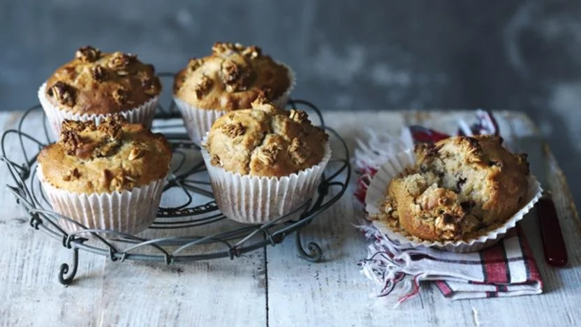 Delicious hazelnut and dried fruit muffins on a rustic wooden table