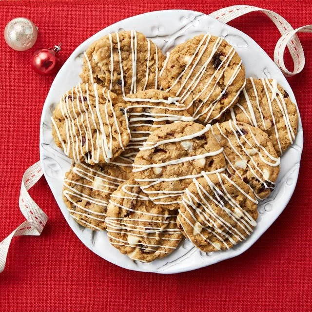 Freshly baked Oatmeal-Cherry Slice-and-Bake Cookies on a cooling rack.