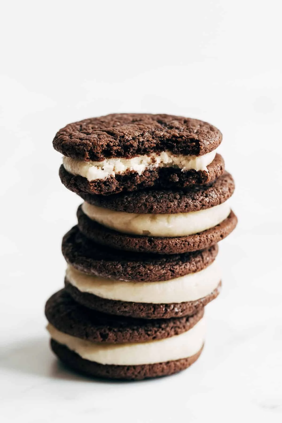 Delicious homemade Oreos on a plate, showcasing their chocolatey goodness.
