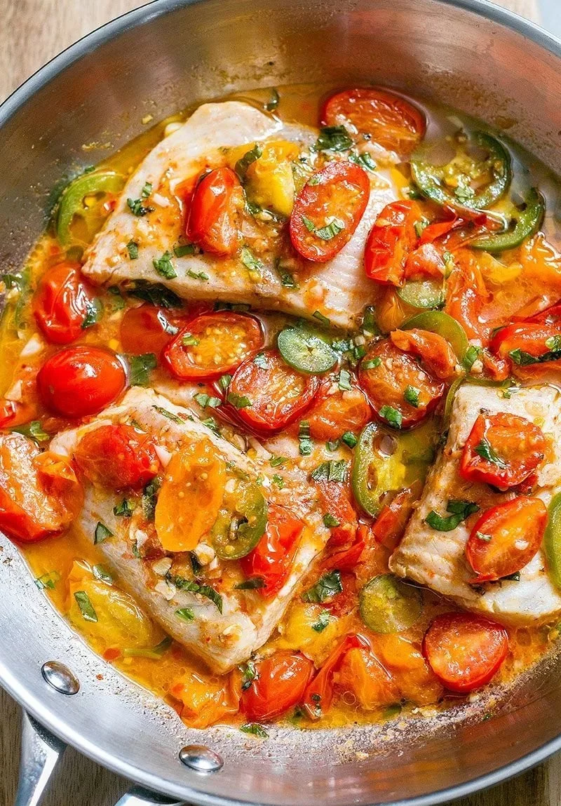 Pan-seared tilapia fillet served in tomato basil sauce