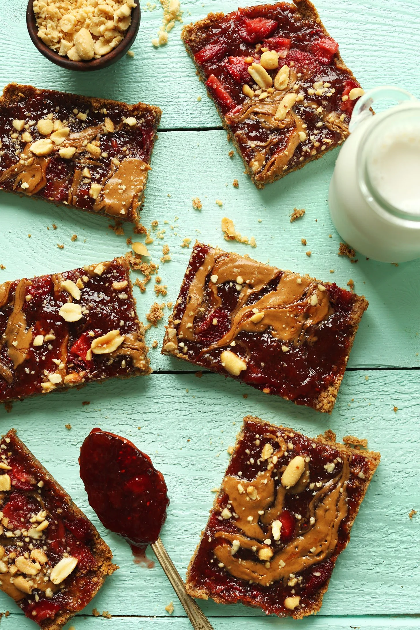 Peanut Butter and Jelly Snack Bars displayed on a table, perfect for snacks.